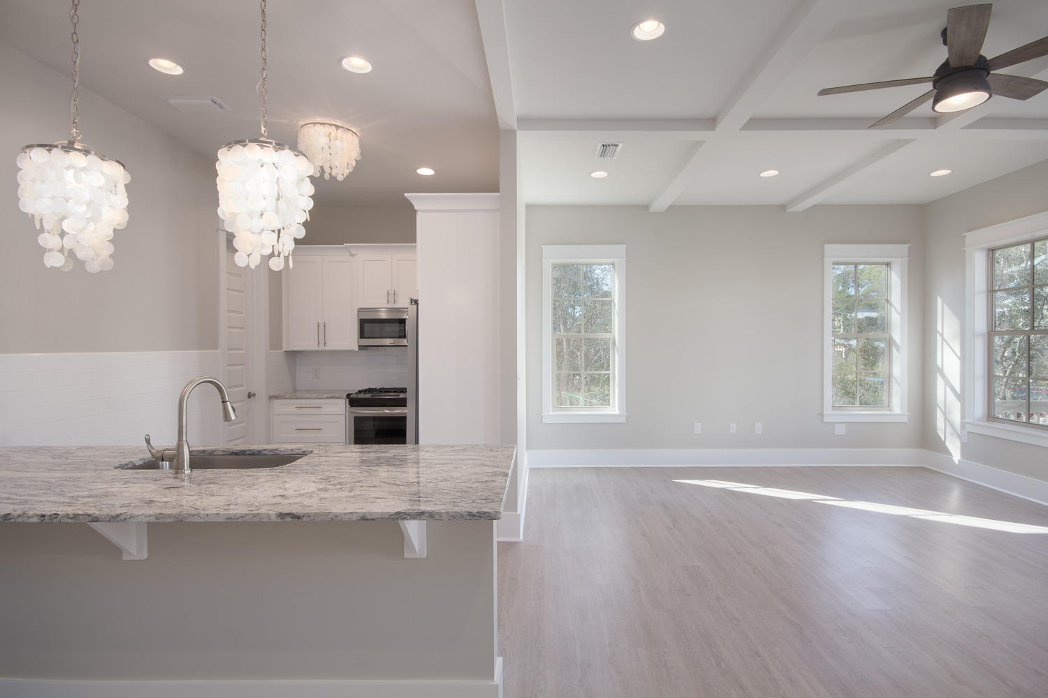 196 Matt's Way Santa Rosa Beach, FL 32459 - Photo 7 of 26 a kitchen with counter top chandelier and living room