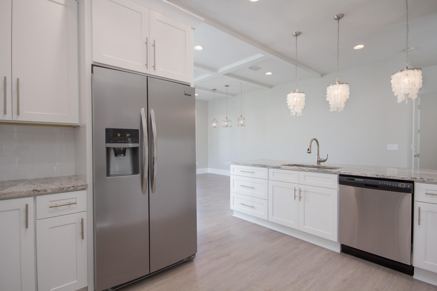 196 Matt's Way Santa Rosa Beach, FL 32459 - Photo 9 of 26 a large kitchen with cabinets and stainless steel appliances