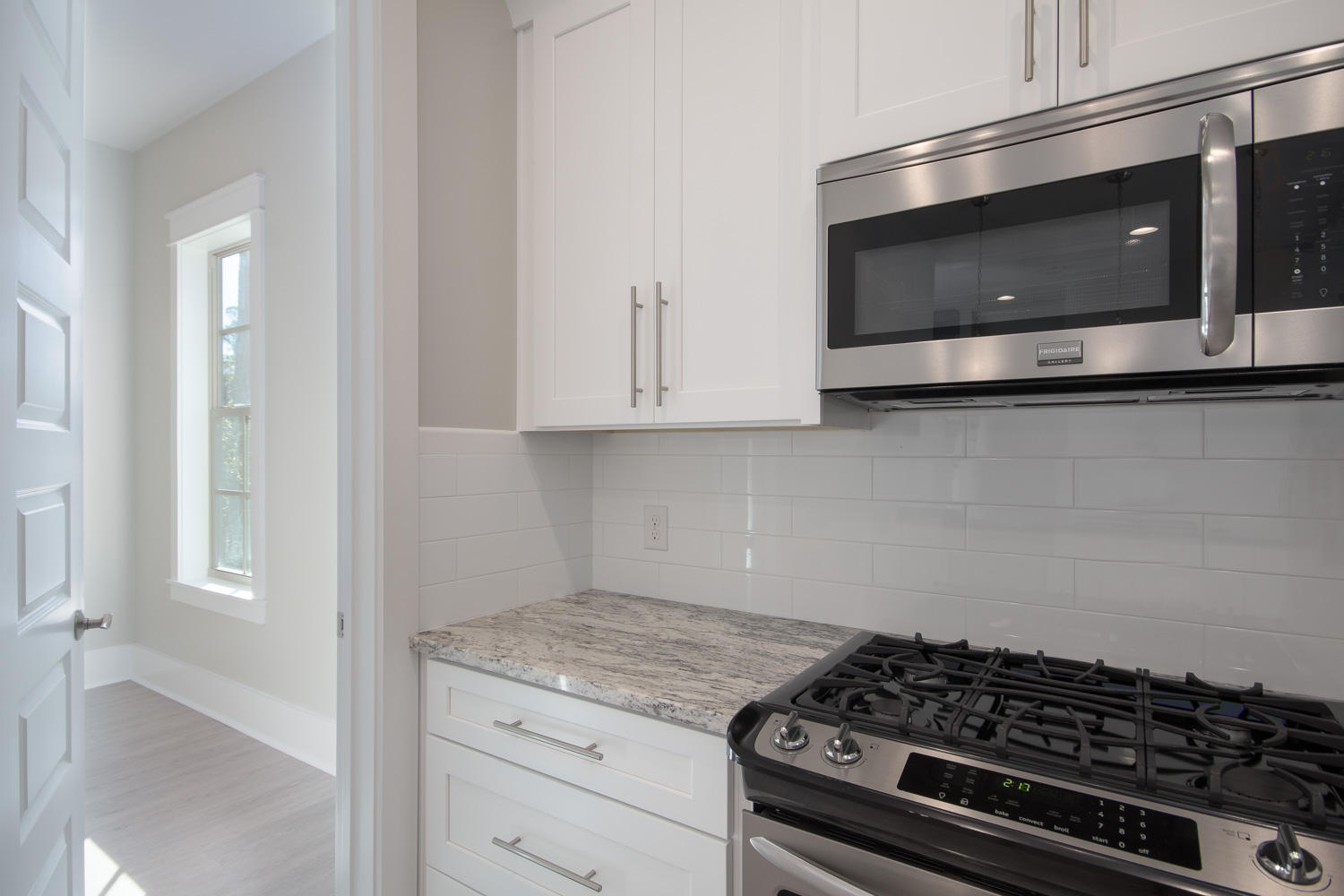 196 Matt's Way Santa Rosa Beach, FL 32459 - Photo 10 of 26 a kitchen with granite countertop a stove and a microwave