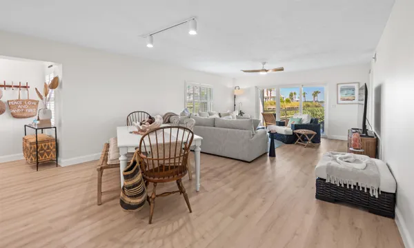 a bedroom with two beds and a chandelier