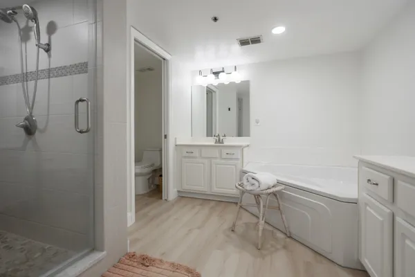 a bedroom with bed and a window