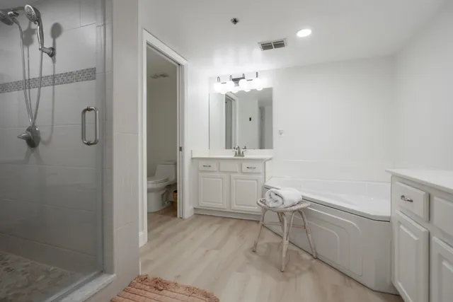 a bedroom with bed and a window