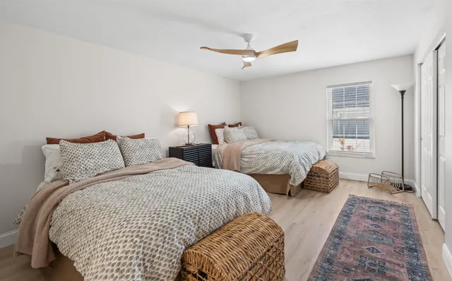 a spacious bathroom with a sink a large mirror and a bathtub