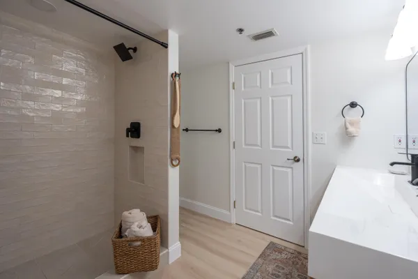 a bedroom with two beds and painted walls