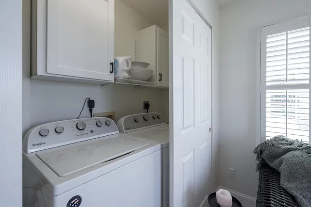 a bathroom with a double vanity sink and mirror