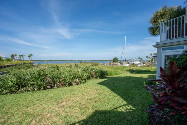 a view of a chairs and table in patio of the house