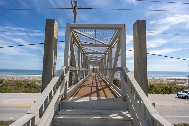 a view of balcony with two chairs and a table