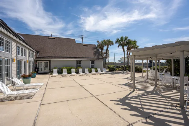 a terrace with a table and chairs