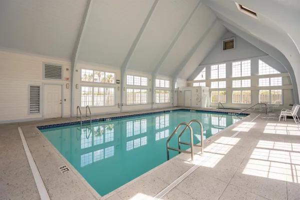 a view of a house with wooden fence