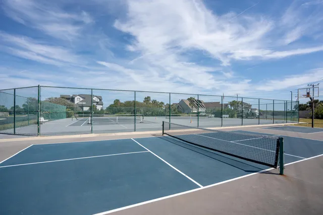 a view of a swimming pool with lounge chair