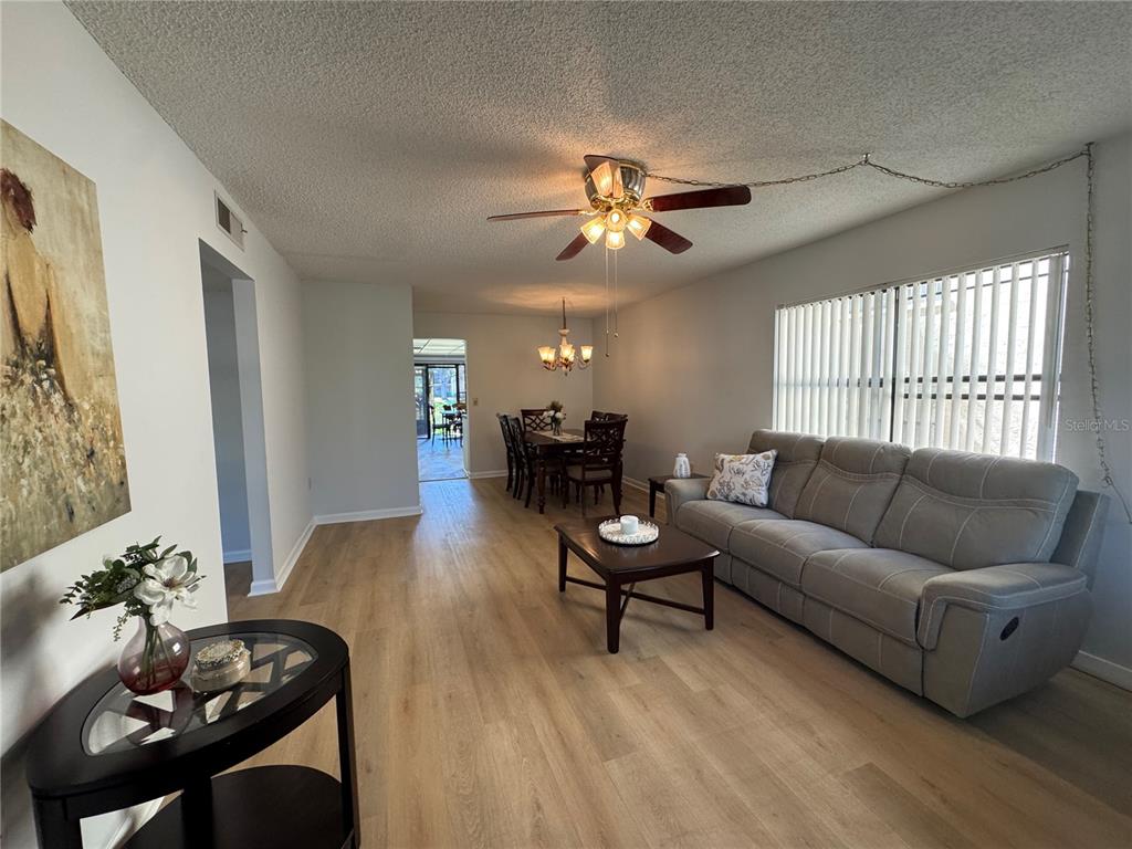 315 30th Avenue West, Unit 101B Bradenton, FL 34205 - Photo 3 of 20 a living room with furniture and a large window