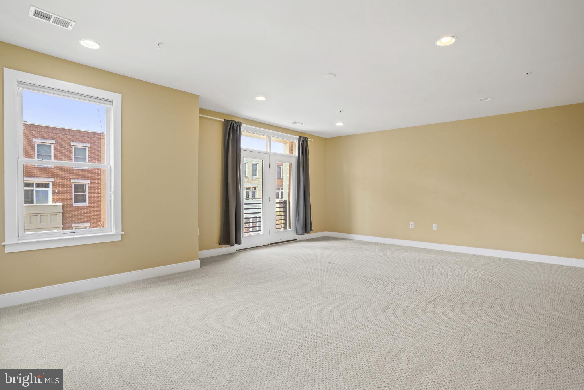 1901 Main Line Boulevard, Unit 102 Alexandria, VA 22301 - Photo 18 of 34 a view of an empty room with a window