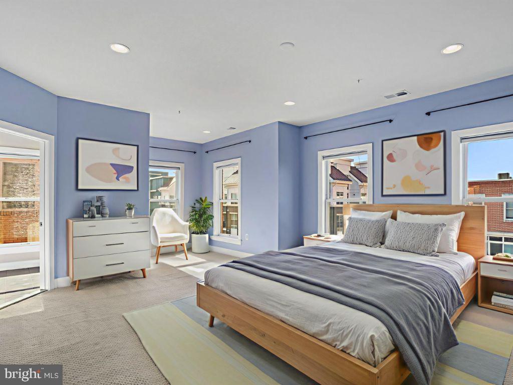 1901 Main Line Boulevard, Unit 102 Alexandria, VA 22301 - Photo 23 of 34 a bedroom with a large bed and a window