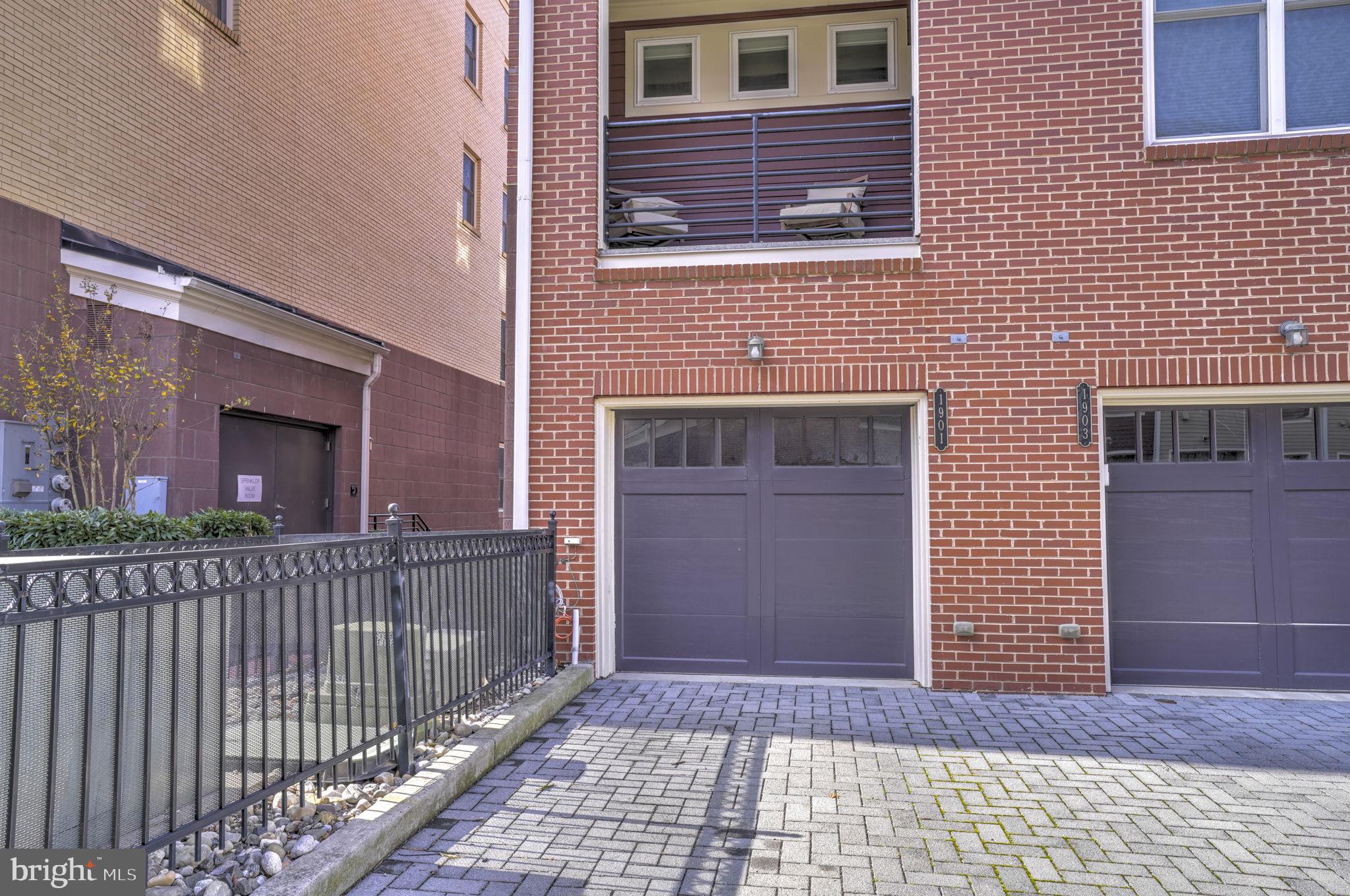 1901 Main Line Boulevard, Unit 102 Alexandria, VA 22301 - Photo 33 of 34 a view of a brick house with many windows