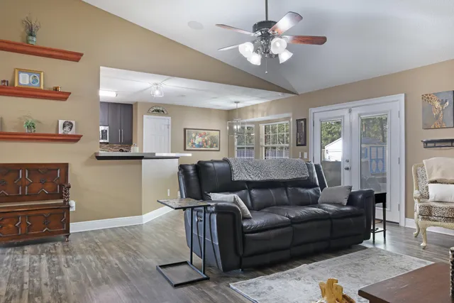 a view of a livingroom with furniture and a flat screen tv