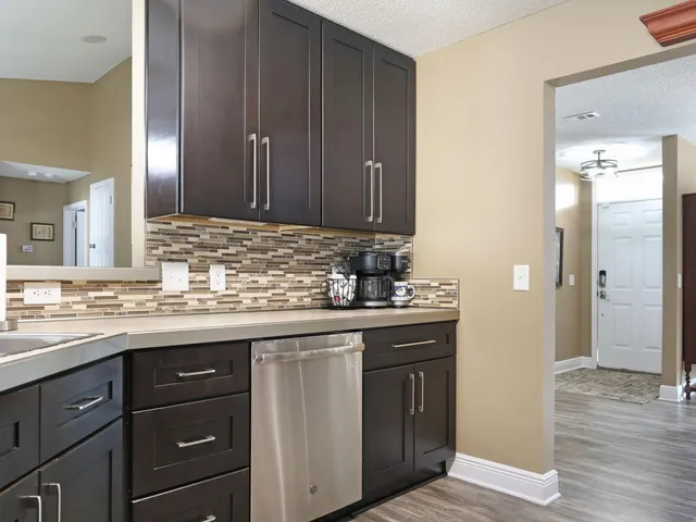 a living room with a couch and a potted plant