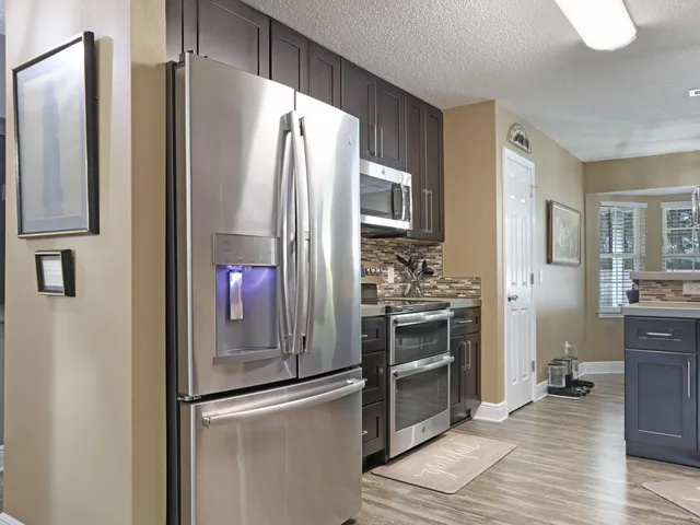 a bedroom with a bed and a mirror on dresser