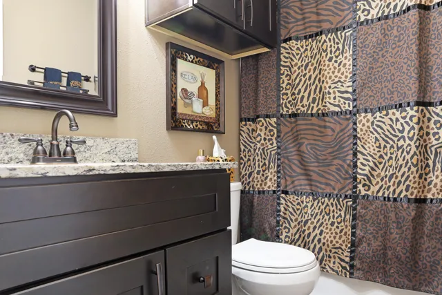 a bathroom with a double vanity sink and mirror
