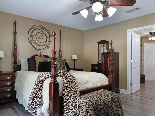 a view of walk in closet with clothes