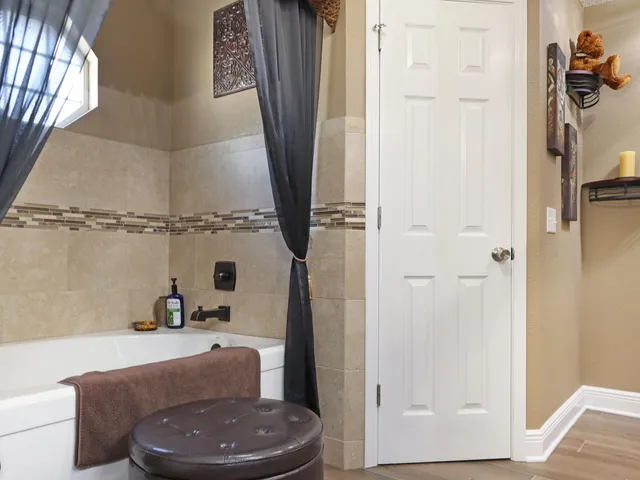 a view of a backyard with swimming pool