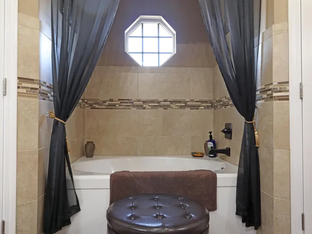 a front view of a house with a garden and yard