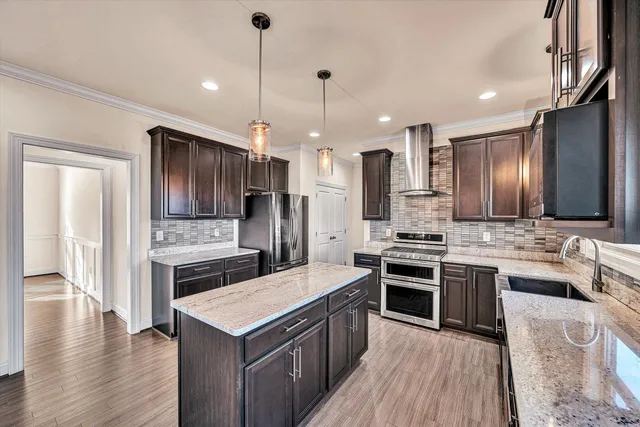 a kitchen with a stove and a refrigerator