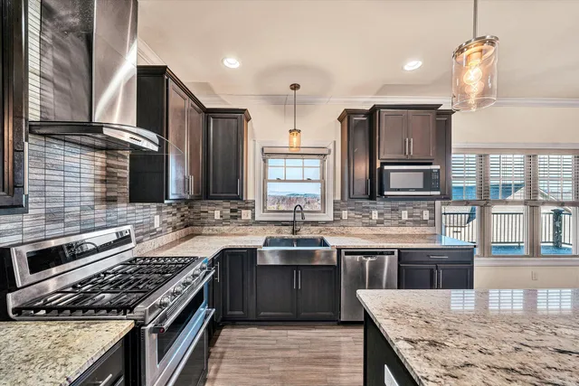 a kitchen with a stove and a sink