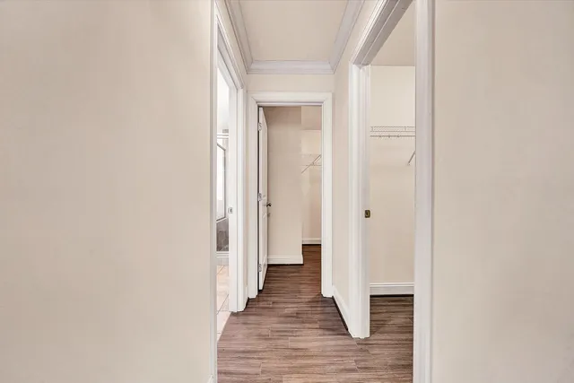 a bathroom with a granite countertop sink a mirror and a bathtub