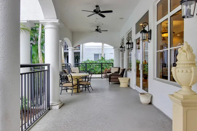 a view of a hallway with wooden floor and a cabinet
