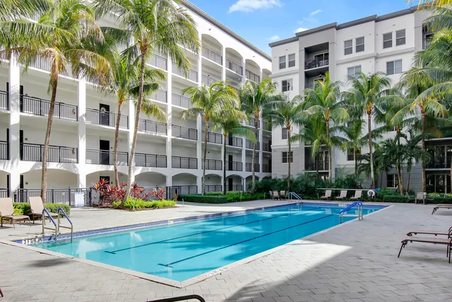 a kitchen with granite countertop a sink and a stove top oven