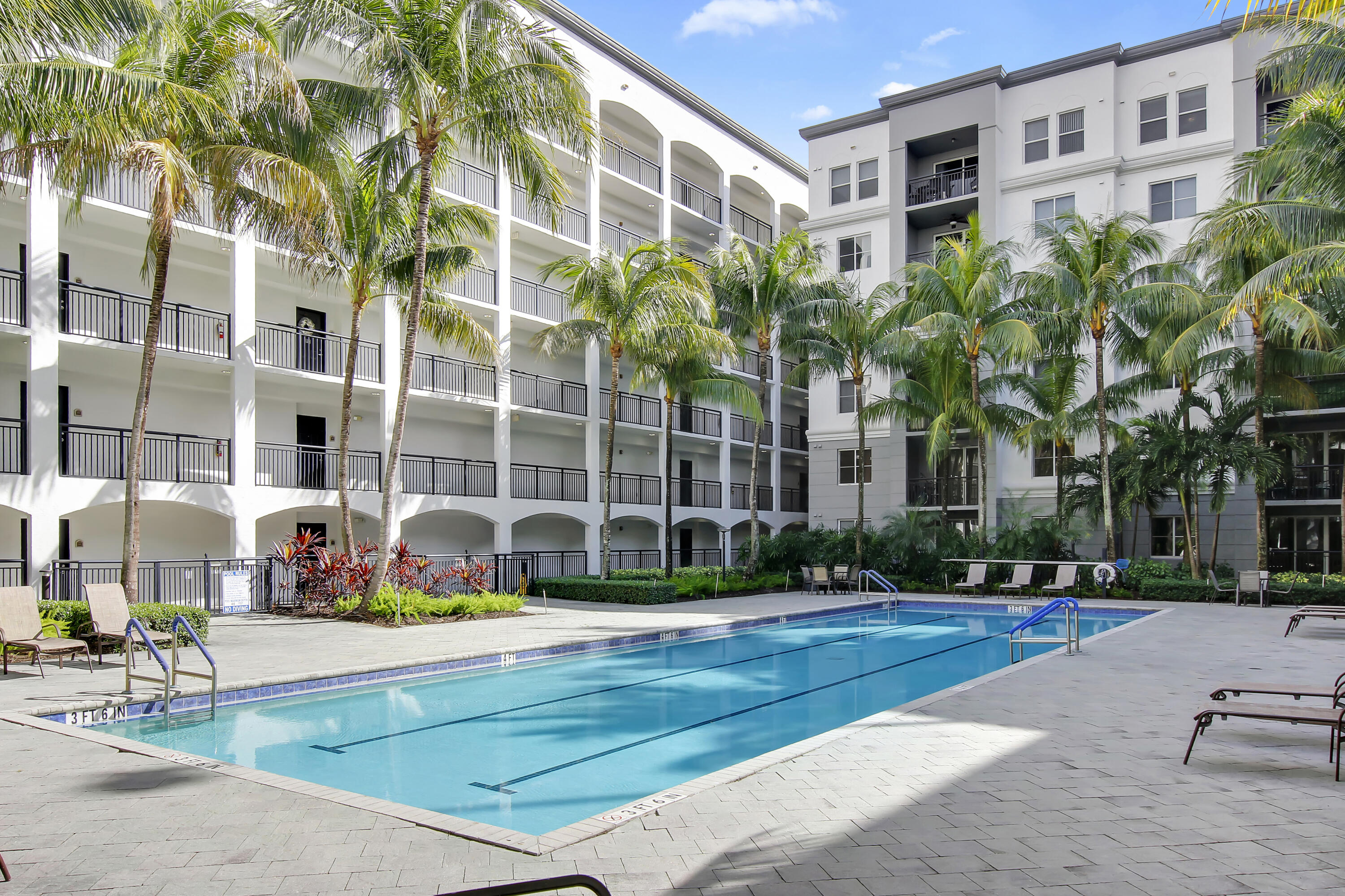 1660 Renaissance Commons Boulevard, Unit 2122 Boynton Beach, FL 33426 - Photo 20 of 38 a view of a building with a yard