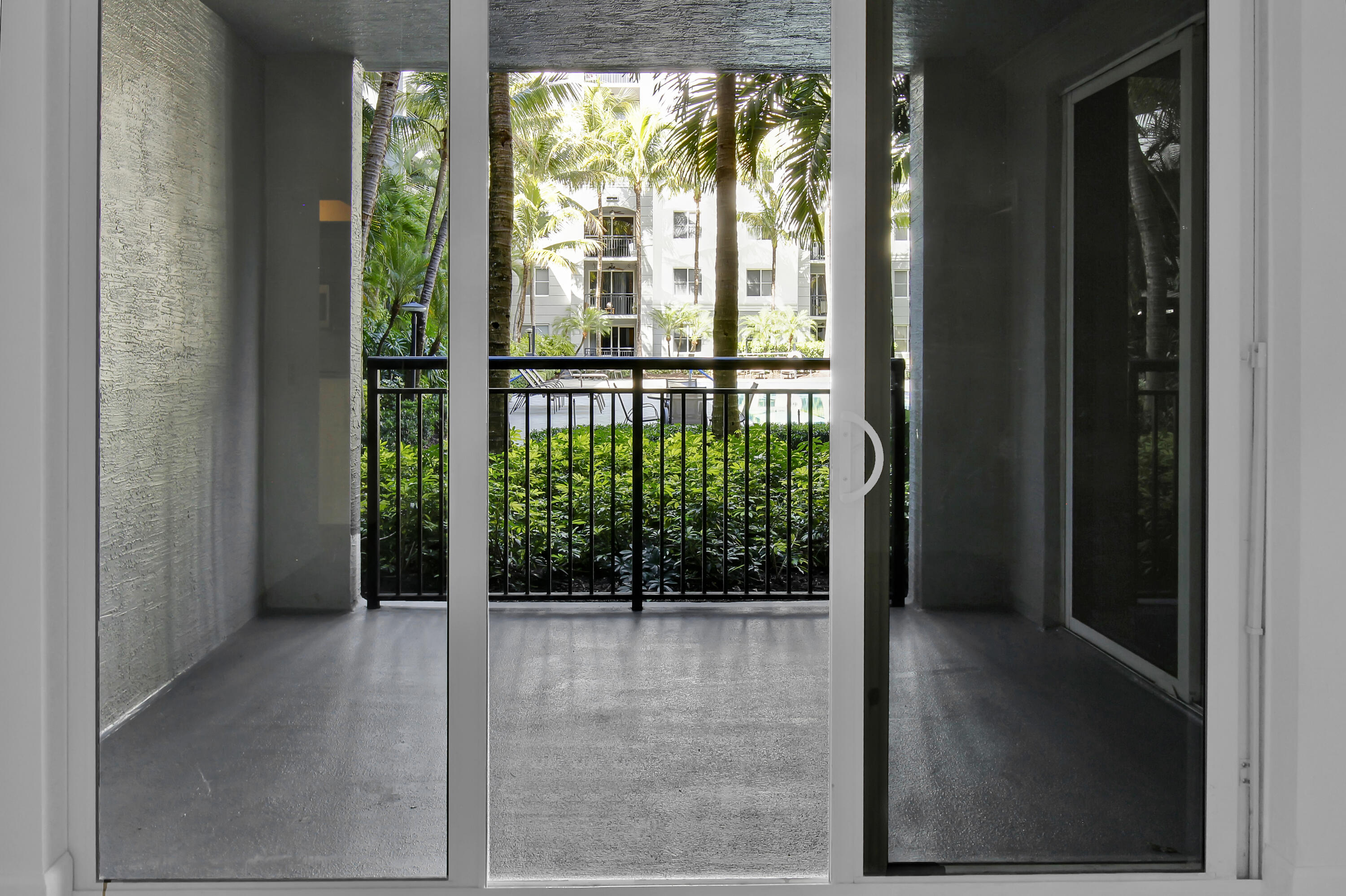 1660 Renaissance Commons Boulevard, Unit 2122 Boynton Beach, FL 33426 - Photo 34 of 38 a view of a glass door with a outdoor space