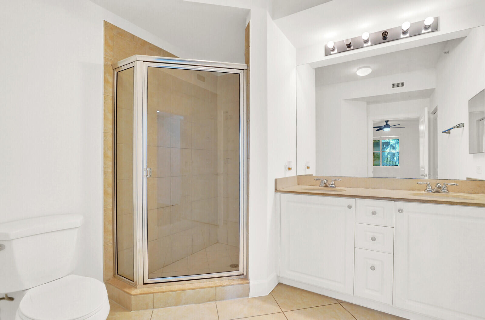 1660 Renaissance Commons Boulevard, Unit 2122 Boynton Beach, FL 33426 - Photo 6 of 38 a bathroom with a granite countertop sink mirror and toilet