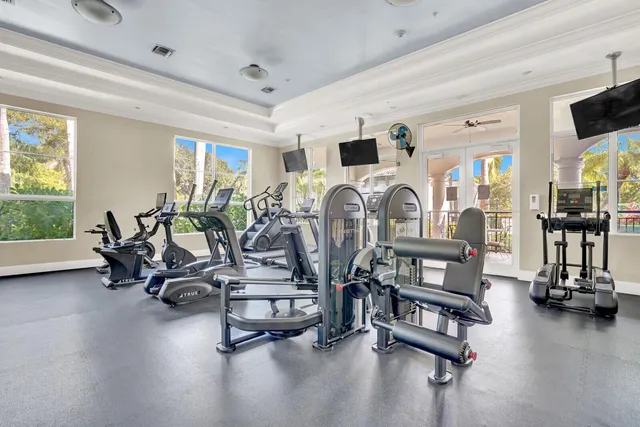 a room with gym equipment and a large window