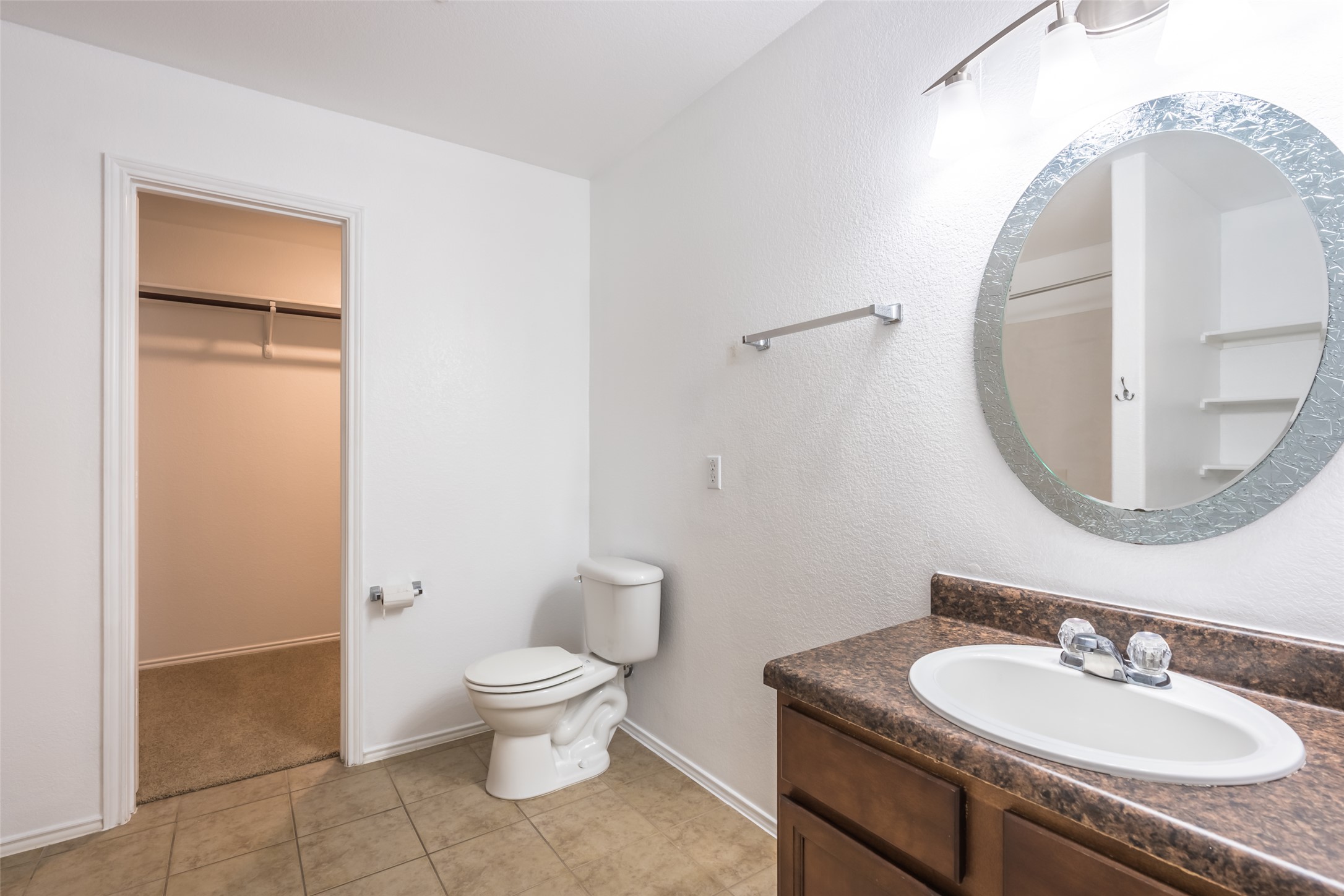 1013 Ranchero Road Leander, TX 78641 - Photo 15 of 30 Functional bathroom design connects directly to a spacious walk-in closet.