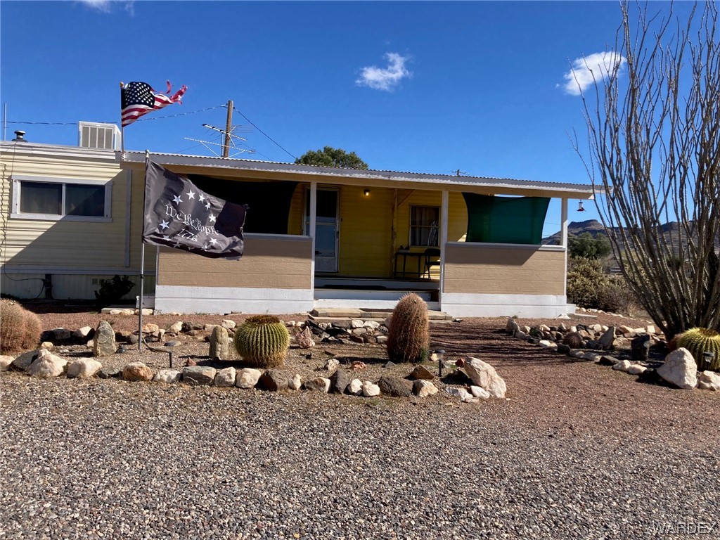 3460 Bouse Road Golden Valley, AZ 86413 - Photo 4 of 79 a front view of a house with a yard