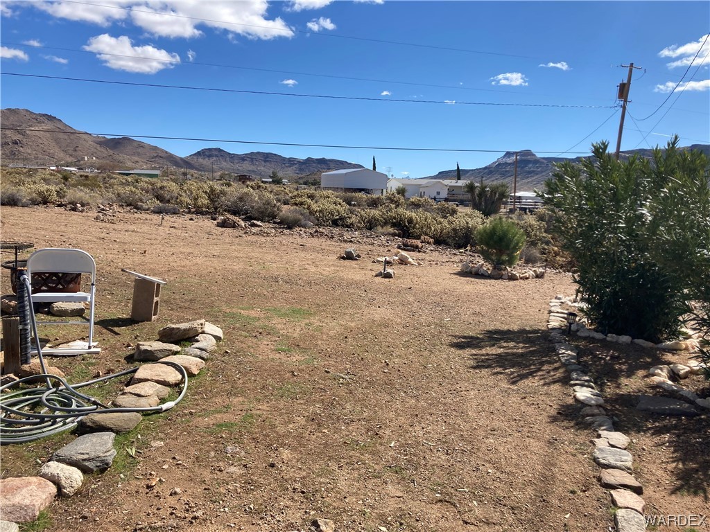 3460 Bouse Road Golden Valley, AZ 86413 - Photo 72 of 79 a view of a lake with a mountain