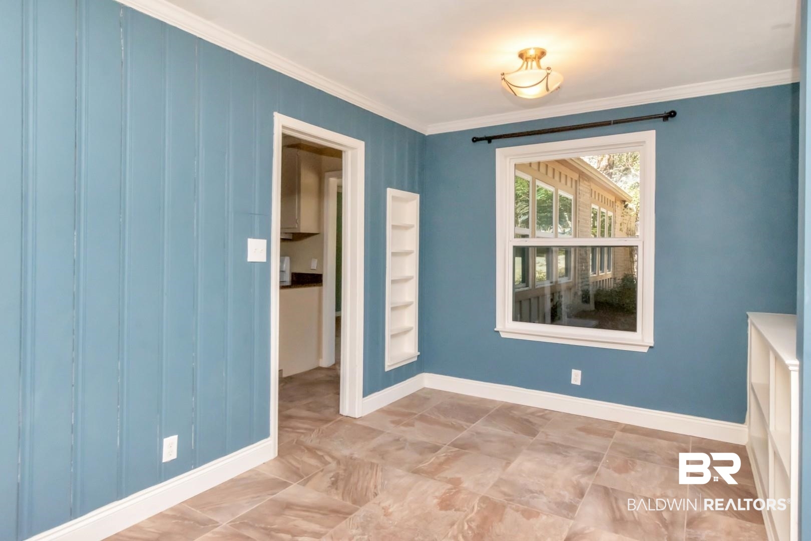 410 St John Place Mobile, AL 36609 - Photo 7 of 32 Spare room with baseboards and crown molding
