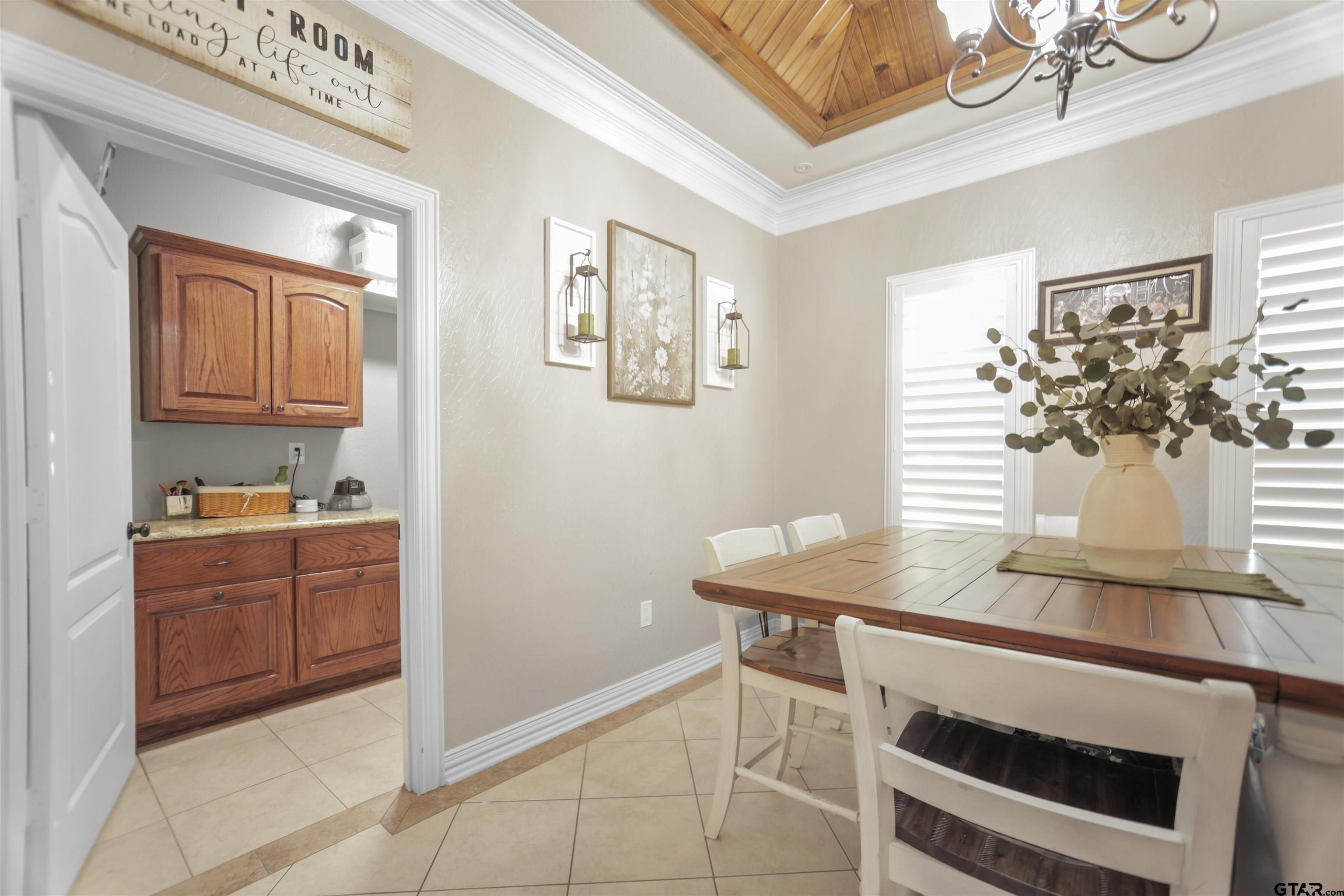 11931 State Highway 64 Tyler, TX 75704 - Photo 27 of 44 a kitchen with a sink cabinets and wooden floor