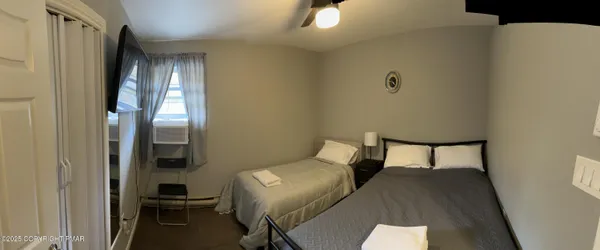 a bedroom with a bed and a table