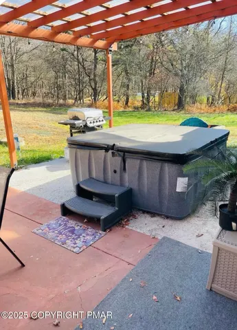 a view of a swimming pool with a patio