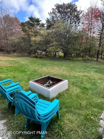 a view of a two chairs in a yard