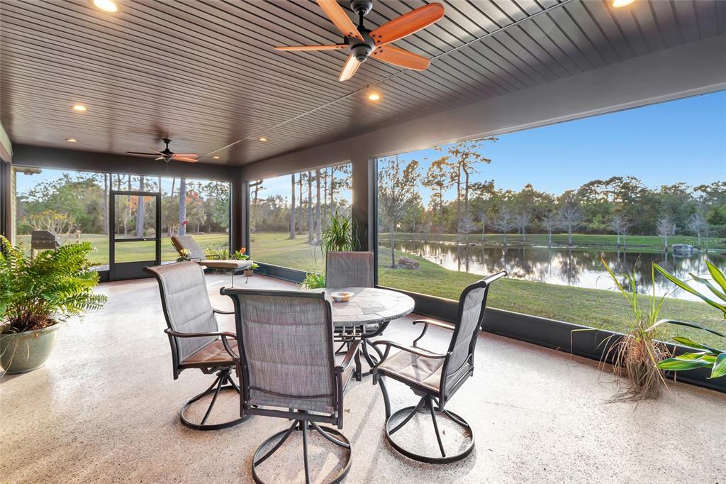7330 Crabgrass Road St. Cloud, FL 34773 - Photo 31 of 60 a dining area with furniture and a lake view