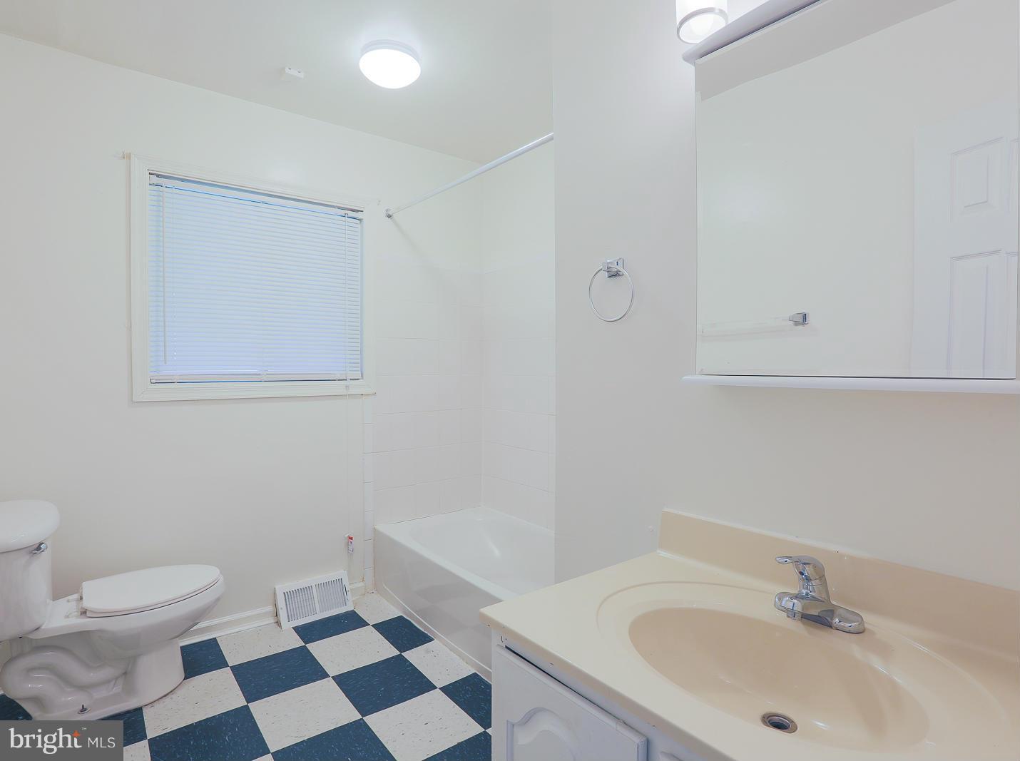 3114 Fairview Road Baltimore, MD 21207 - Photo 22 of 30 a bathroom with a sink and a toilet