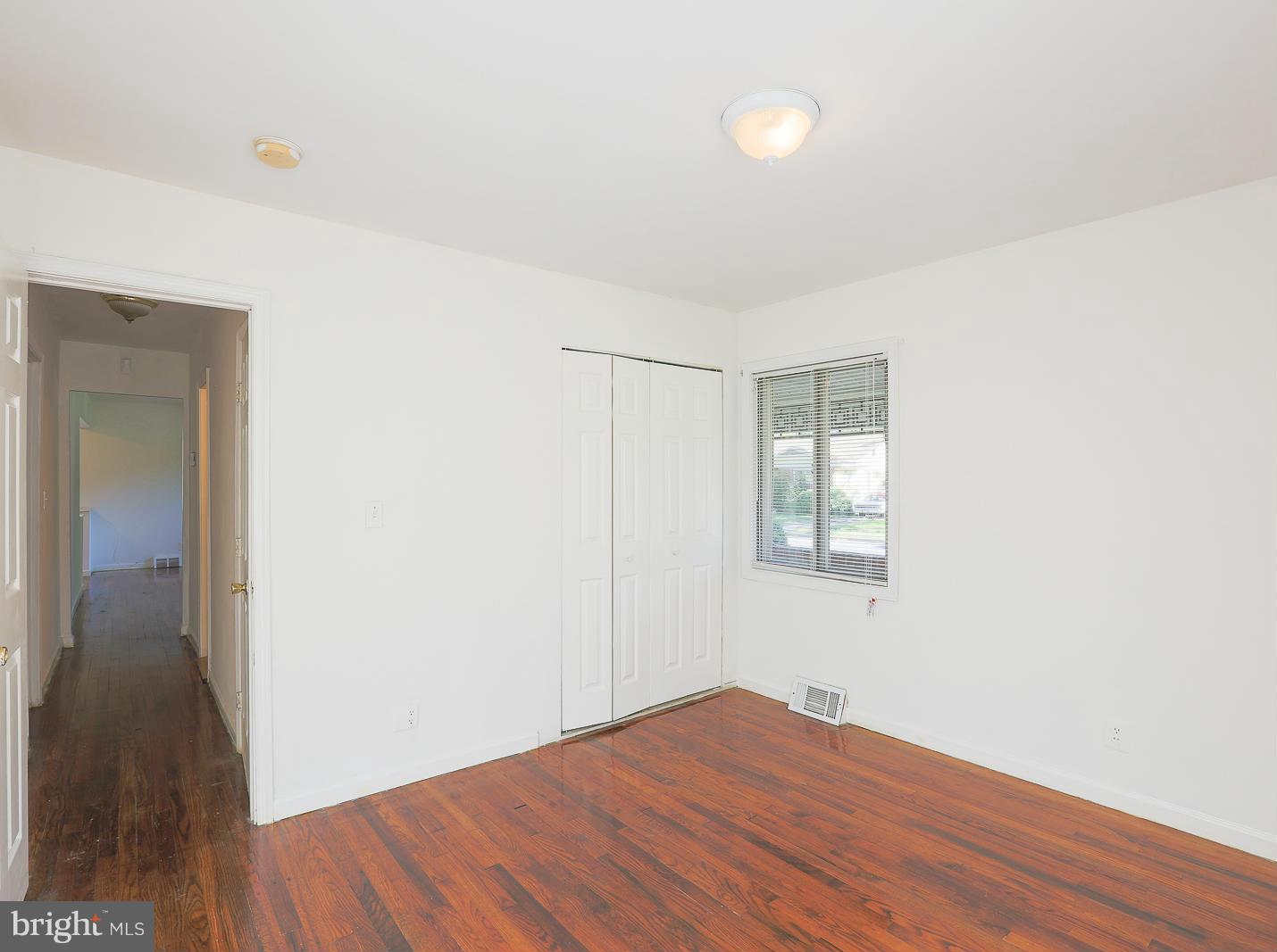 3114 Fairview Road Baltimore, MD 21207 - Photo 23 of 30 a view of empty room with wooden floor and fan