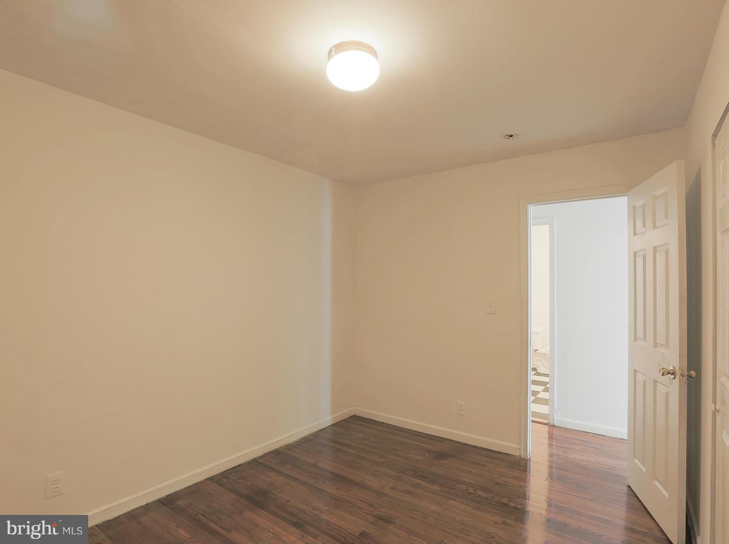 3114 Fairview Road Baltimore, MD 21207 - Photo 24 of 30 a view of an empty room with wooden floor