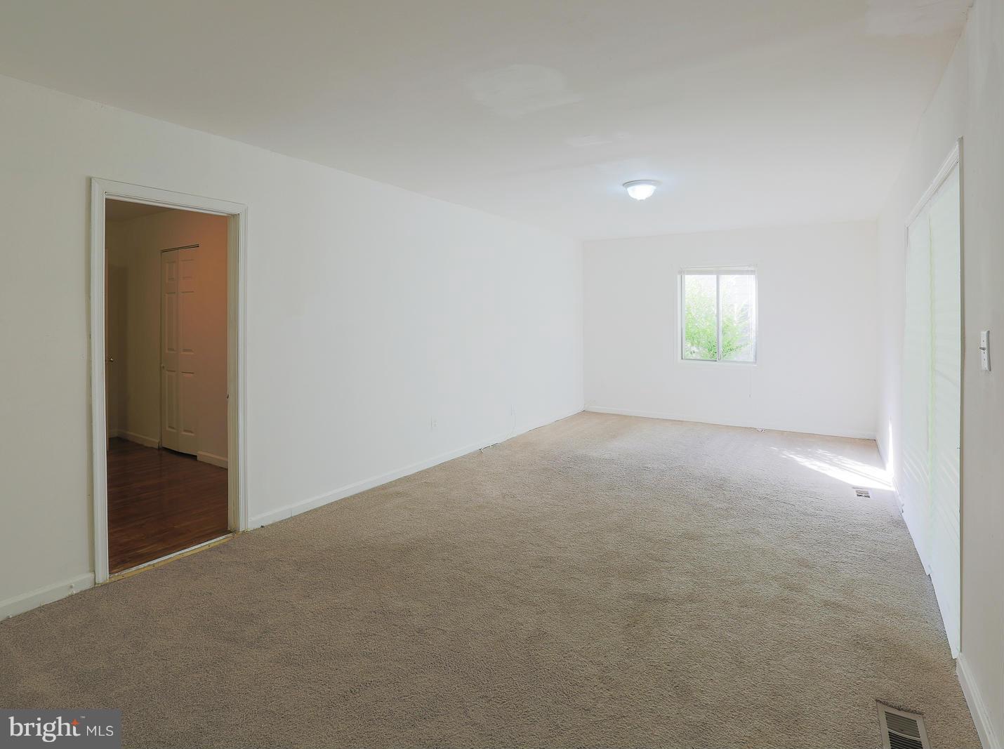3114 Fairview Road Baltimore, MD 21207 - Photo 26 of 30 an empty room with windows and closet