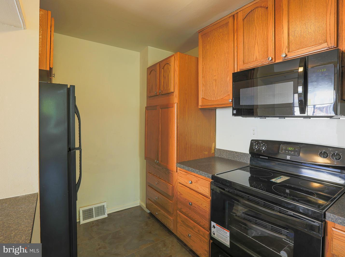 3114 Fairview Road Baltimore, MD 21207 - Photo 4 of 30 a kitchen with sink and refrigerator