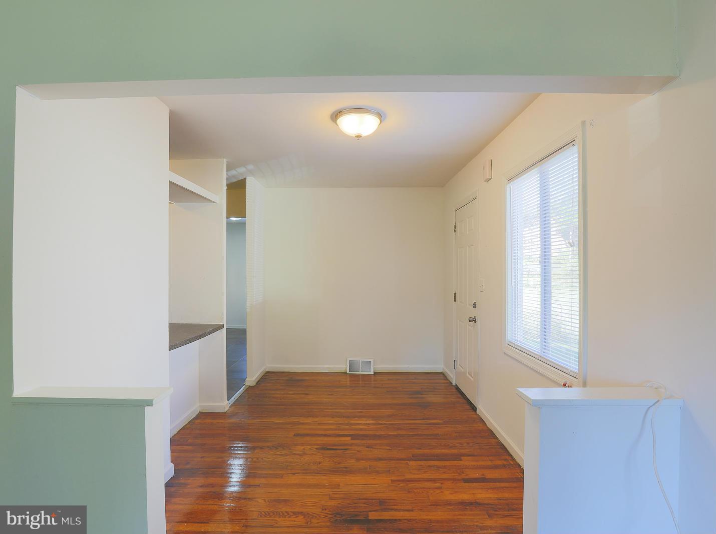 3114 Fairview Road Baltimore, MD 21207 - Photo 9 of 30 a bedroom with a bed and a window