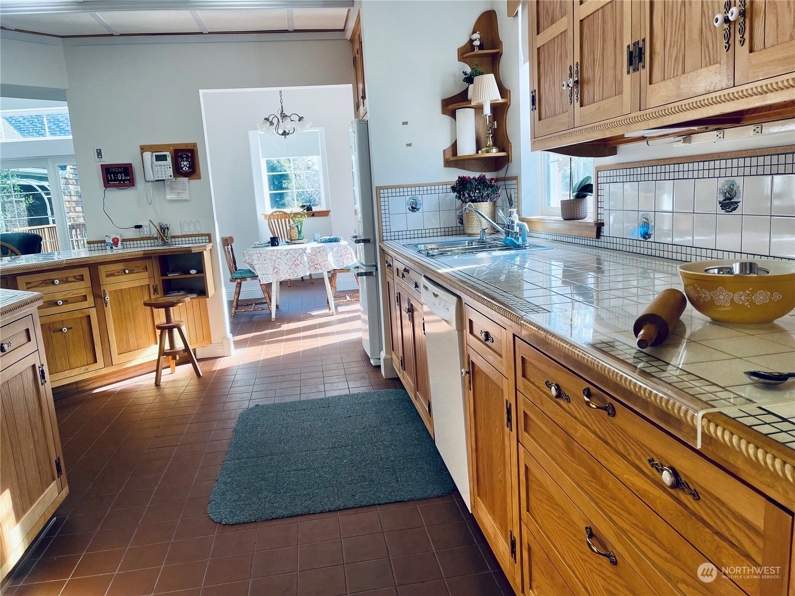 36808 Stackpole Road Oysterville, WA 98641 - Photo 12 of 40 a kitchen with stainless steel appliances granite countertop a stove a sink and a refrigerator